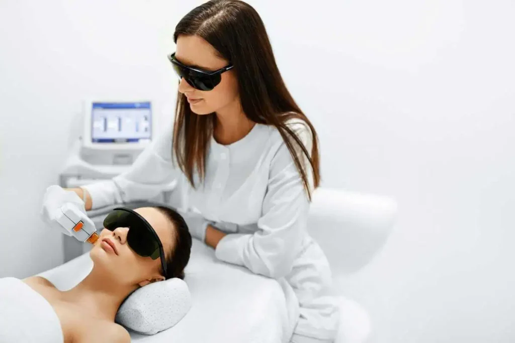 Young woman receiving IPL photo facial treatment at Germain Dermatology in Mt Pleasant